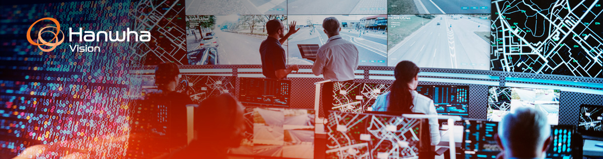 Operators monitoring video surveillance data in a control room.
