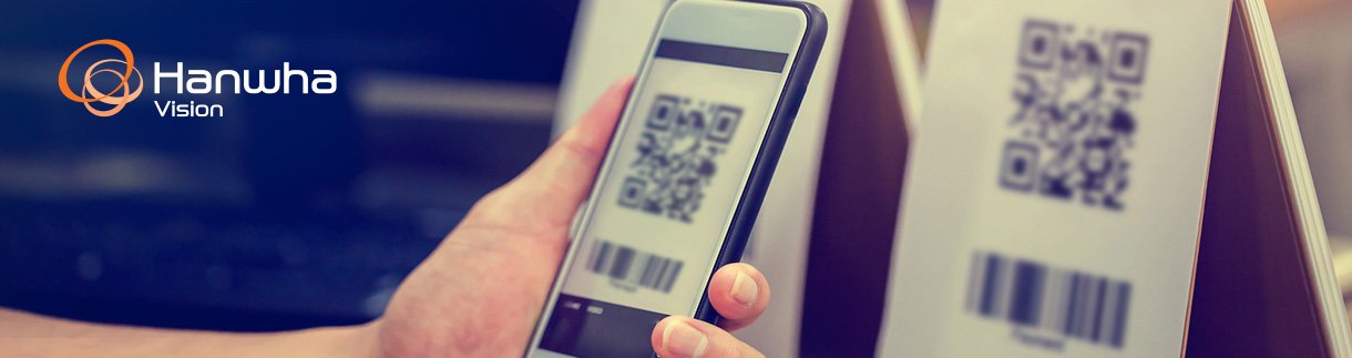 A person scanning a QR code with their phone.