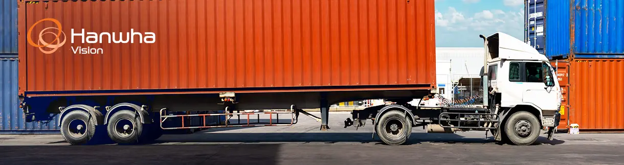 banner_1_cargo_theft (1) A cargo truck with a shipping container at a freight yard
